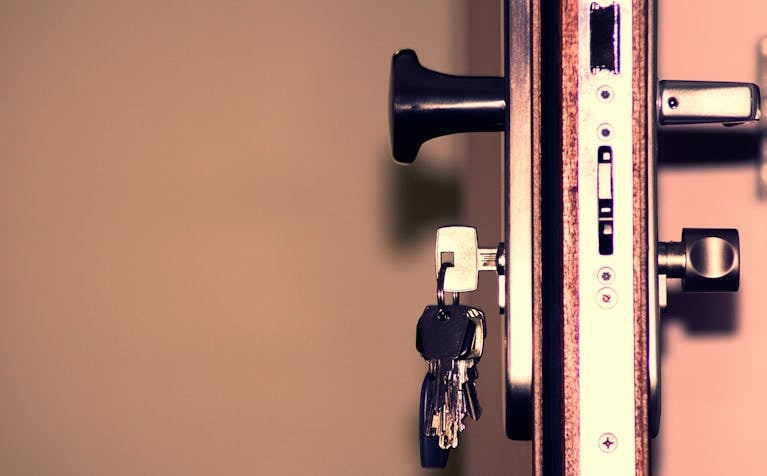 Detailed view of a door lock and keys emphasizing security and access.